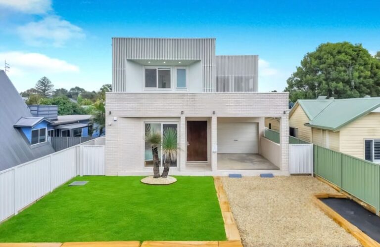 Finished new house with lawn, gravel driveway and sandstone edging